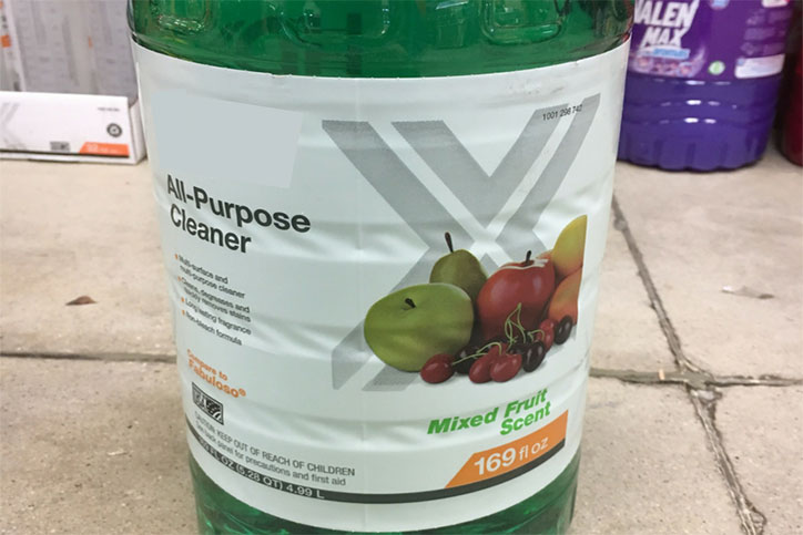 Household cleaner with fruit pictured on label.