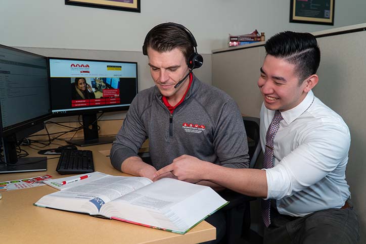 Toxicologist and pharmacy student reading a book