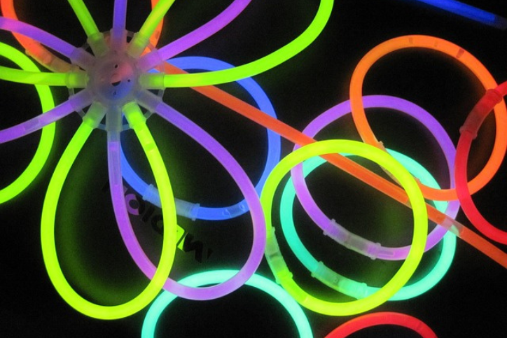 Multicolored glow sticks made into a ball and bracelets
